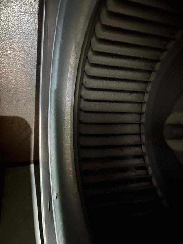 Completed preventive maintenance tune-up on HVAC system under service agreement PTU BOGO8-1279. Inspected blower assembly and evaporator coil, documenting significant dust and debris accumulation on squirrel cage blower wheel and coil fins that can restrict airflow and reduce system efficiency. Photographed conditions for service records showing normal wear patterns consistent with extended operation between maintenance intervals.