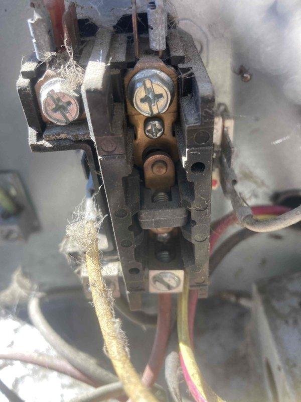 # HVAC Maintenance - Agreement Visit - AC&SI

Completed prepaid air conditioner tune-up maintenance on residential cooling system with no customer-reported issues or symptoms. Performed comprehensive inspection of outdoor AC unit, including electrical system evaluation. During inspection, identified aging electrical contactor assembly showing signs of wear, with deteriorated wire insulation on multiple conductor connections, frayed yellow wiring with exposed copper, and remnants of deteriorating cloth insulation material. Observed oxidation and discoloration on brass contact points and metal housing components indicating extended service life.

Conducted electrical diagnostic testing using clamp meter to verify system performance parameters. Recorded amperage draw of 199 amps and voltage reading of 90 volts during operational assessment. All measurements documented photographically for service records. System operational at time of service completion. Recommended monitoring contactor a