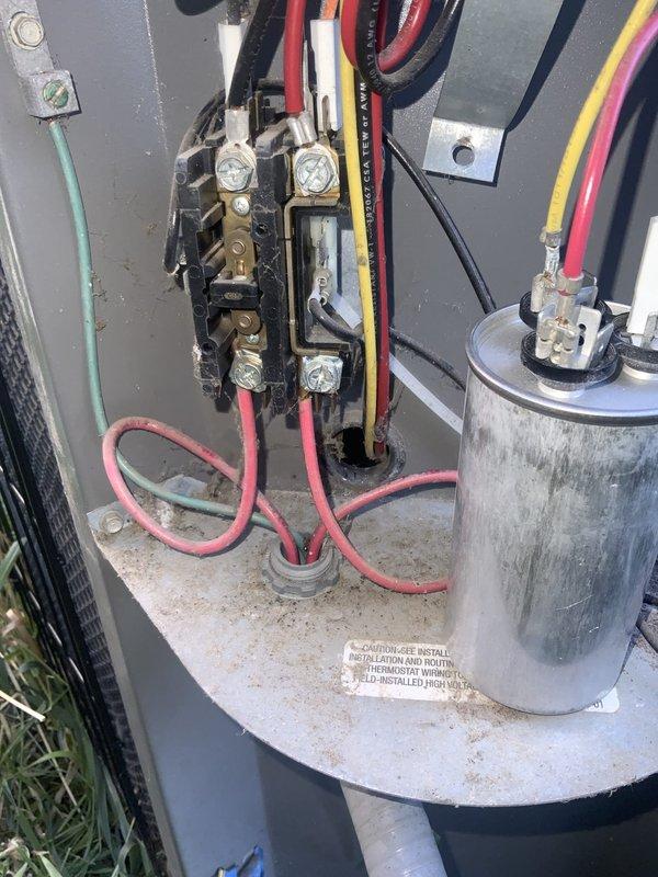 Responded to no-cooling call on 20-year-old central air conditioning system. Upon inspection, discovered low-voltage control wiring between outdoor condensing unit and thermostat had been severed during lawn maintenance. Repaired damaged control circuit wiring at outdoor disconnect junction, restored proper connections at terminal block, and verified all wire terminations were secure. Tested system operation and confirmed outdoor unit now receiving proper signal from thermostat with normal cooling function restored.