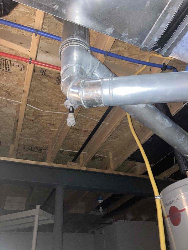 Performed preventive maintenance tune-up on HVAC system. Inspected ductwork installation and mechanical components in basement area, verified proper routing of gas line and refrigerant lines. Measured electrical parameters using digital multimeter, confirmed system drawing 232 amps with proper voltage readings, all measurements within normal operating range for equipment specifications.
