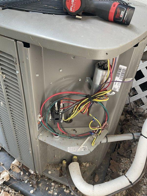 Completed preventive maintenance agreement visit on residential air conditioning system. Performed thorough inspection of outdoor condenser unit, documenting heavy dust and debris accumulation on coil fins and collection of leaves and particulate matter at base of unit. Accessed indoor air handler components, inspecting electrical connections, capacitor, and refrigerant lines, verifying all wiring and mechanical components were secure and functioning properly.