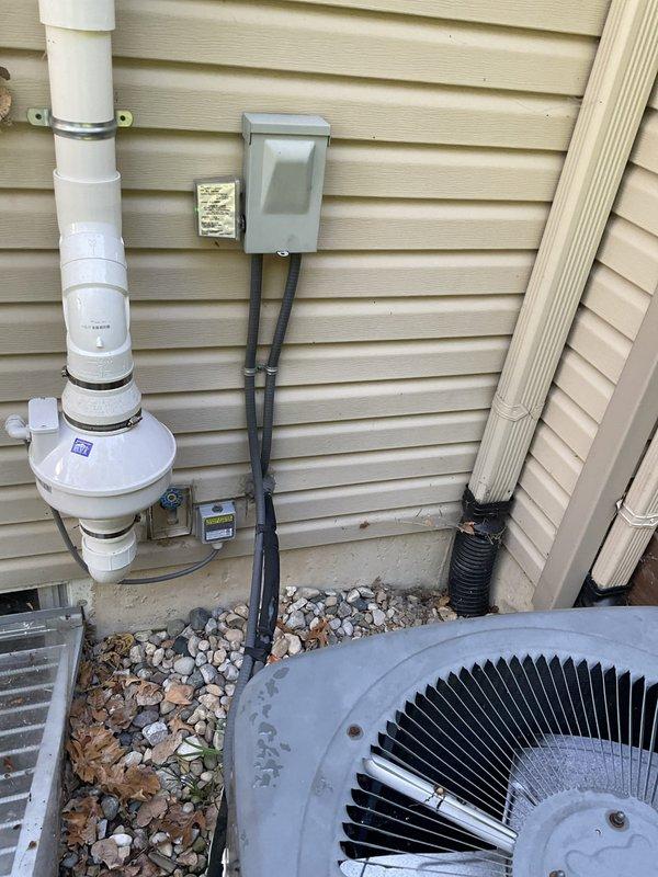 Conducted on-site evaluation of residential HVAC system installed in 2004, consisting of R-22 air conditioning unit and furnace. System assessment revealed low refrigerant charge in the air conditioning condenser unit. Documented existing equipment conditions through photographic records showing outdoor condenser unit mounted on concrete pad with proper electrical disconnect, condensate drainage system, and standard utility connections. Provided comprehensive replacement estimate for aging HVAC system due to obsolete R-22 refrigerant and equipment age approaching end of serviceable life expectancy.
