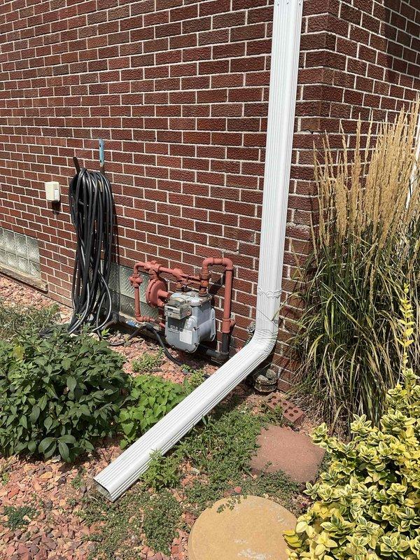 Conducted on-site evaluation of residential HVAC system originally installed in 2007 following fan motor failure. Assessed complete system condition and determined full replacement necessary due to age and equipment deterioration. Documented existing exterior unit location adjacent to gas meter installation on brick exterior, photographed site conditions including clearances and access points for replacement equipment installation planning.