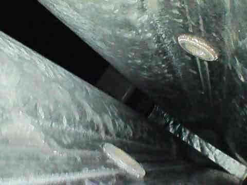 Completed scheduled AC maintenance agreement visit for club membership AC12-4. Upon inspection, discovered significant frost and ice accumulation on supply ductwork in mechanical space, indicating potential refrigerant flow issues or airflow restrictions. Documented conditions with photos showing heavy crystalline frost buildup on insulated metal ducts. System requires further diagnostic evaluation to determine root cause of icing condition, which may include checking refrigerant charge levels, airflow measurements, and thermostat cycling patterns.