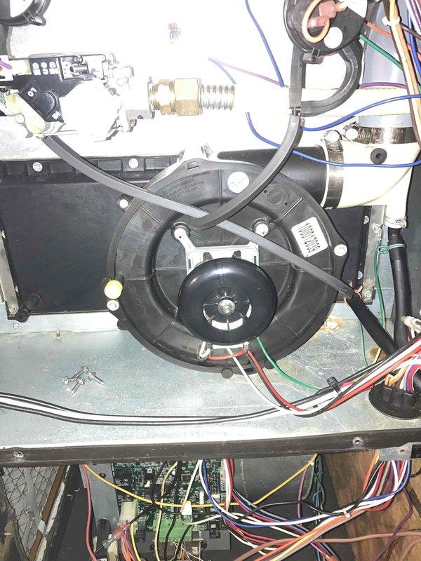 Completed preventive maintenance agreement visit for Club AC8-12 system. Performed comprehensive inspection of air handler unit, including internal blower motor assembly, electrical connections, and control components. Verified proper operation of blower motor and capacitor. Inspected all electrical wiring, terminals, and connection points for signs of wear or damage. Checked air filter condition and documented filter media showing moderate dust accumulation with pleated filter material intact. All electrical connections found secure with no loose terminals or corroded wires. Blower assembly operating within normal parameters. System components photographed for maintenance records. Unit operational at time of departure.