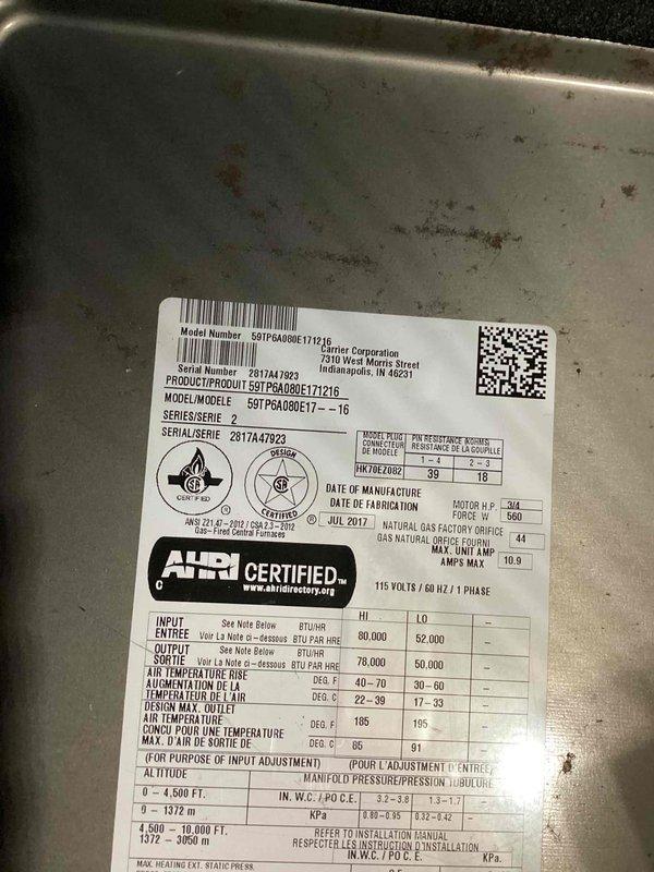 Completed routine preventative maintenance agreement visit on a 9-year-old Carrier HVAC system, model 59TPA080E171216, manufactured July 2017. Performed comprehensive AC tune-up including system inspection, electrical testing with multimeter (recorded 7.48 reading), verification of unit specifications against manufacturer data plate, and visual assessment of heat exchanger components. All equipment operating within normal parameters with no deficiencies noted; system cleared for continued operation.