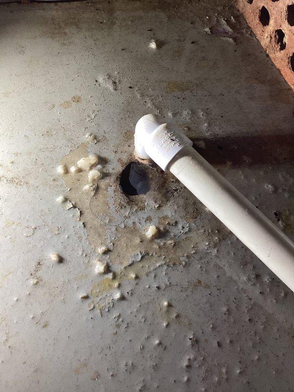 Responded to service call for water leak from indoor AC unit installed one month prior. Upon inspection, discovered compromised condensate drain line with damaged PVC piping and deteriorated insulation in utility closet area. System was actively cooling but condensate water was leaking onto floor due to broken drain pipe. Removed damaged section of drain line, cleared debris, and installed new PVC drain piping with proper insulation to restore proper condensate drainage and prevent future water damage.