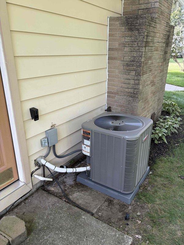 Completed full HVAC system installation including a 70,000 BTU gas furnace and 2.5-ton air conditioning unit. Furnace was wall-mounted in interior mechanical closet with new venting and ductwork connections installed. AC condenser positioned on concrete pad in right side yard with electrical disconnect, conduit, and refrigerant line set properly routed and secured to exterior wall. Installed whole-home humidifier integrated with furnace system. All gas connections, electrical wiring, and condensate drainage completed to code. System tested and verified operational with proper airflow, temperature differential, and safety controls functioning as designed.