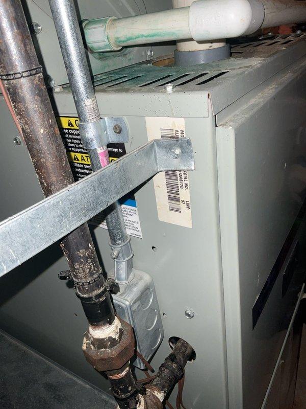 Completed preventative maintenance agreement visit on American Standard Allegiance 10 air conditioning system (Model 7A0030A100A2, Serial 2303JFA4F) manufactured July 2002. Performed comprehensive inspection of both indoor furnace unit and outdoor condenser, including visual assessment of refrigerant lines showing age-related corrosion on copper piping, PVC condensate drainage system, electrical connections at outdoor disconnect, and overall system operation. All components inspected per Club AC10-2 maintenance protocol, with photographic documentation of equipment nameplates and mechanical room installation completed for service records.