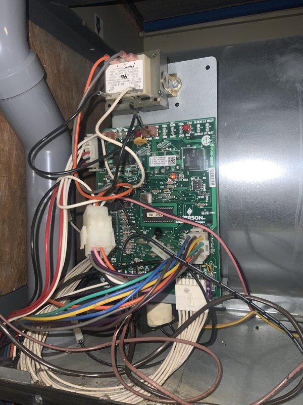 Completed routine preventive maintenance inspection on residential HVAC system under Club AC12-4 agreement. Performed comprehensive evaluation of blower assembly, confirming proper operation of squirrel cage fan and noting dust accumulation on blower wheel fins and housing. Inspected control board assembly, verifying all electrical connections, wire harnesses, and transformer components for secure mounting and proper function. Documented equipment condition with photographic records showing blower wheel configuration and dual-board control system with associated wiring connections.