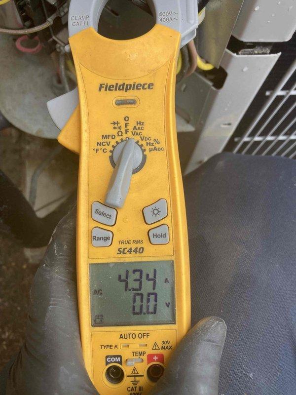 Completed prepaid air conditioning tune-up and preventive maintenance during requested afternoon appointment window. Performed comprehensive system inspection of outdoor AC unit, measured electrical parameters including amperage draw of 434A using clamp meter, verified proper voltage readings, and inspected capacitor operation. Evaluated ductwork connections and support structures in basement area, confirmed proper installation and secure mounting of supply ducts to floor joists, and documented system condition with photographs for maintenance records.