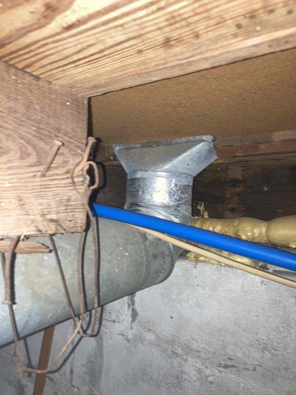 Completed prepaid air conditioning tune-up and preventive maintenance during requested afternoon appointment window. Performed comprehensive system inspection of outdoor AC unit, measured electrical parameters including amperage draw of 434A using clamp meter, verified proper voltage readings, and inspected capacitor operation. Evaluated ductwork connections and support structures in basement area, confirmed proper installation and secure mounting of supply ducts to floor joists, and documented system condition with photographs for maintenance records.
