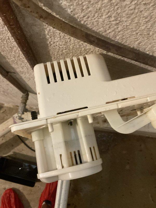 Responded to emergency no-cooling call on four-year-old air conditioning system. Upon inspection, identified failed condensate pump preventing system operation due to safety float switch activation. Removed and cleaned pump assembly, which showed signs of sediment buildup and motor wear. Reinstalled pump in proper location within mechanical space above insulated ceiling area. Verified proper drainage operation, tested safety float mechanism, and confirmed system returned to normal cooling operation. Unit now operating within manufacturer specifications.