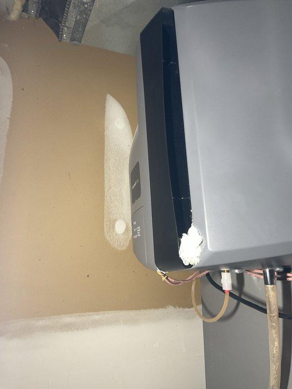 Completed prepaid air conditioning maintenance tune-up on residential HVAC system. Performed comprehensive inspection of outdoor condensing unit and indoor air handler, checking refrigerant lines, electrical connections, and control panel operations. Documented Honeywell Home humidifier with illuminated "Change Pad" service indicator requiring future attention per manufacturer specifications.