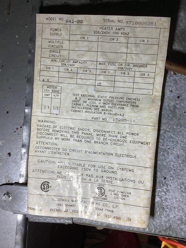 Completed preventative maintenance agreement visit on Goodman air conditioning system, model AA2-00, serial number 5710080281. Performed comprehensive inspection of outdoor condensing unit, verified electrical measurements reading 123 on clamp meter, documented equipment nameplate specifications showing 208/240V 1PH 60HZ power supply and R22 refrigerant system. All system components operating within manufacturer specifications; photographic documentation captured for service records.