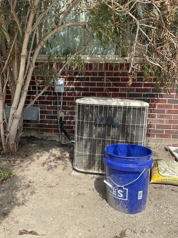 Provided estimate for complete HVAC system replacement including 24-year-old outdoor condensing unit located on exterior concrete pad against brick wall and indoor natural gas furnace situated in basement mechanical room. Both units have reached end of expected service life and require replacement to ensure continued reliable heating and cooling operation.