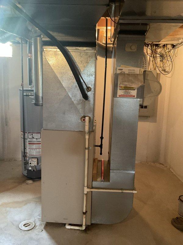 Provided estimate for complete HVAC system replacement including 24-year-old outdoor condensing unit located on exterior concrete pad against brick wall and indoor natural gas furnace situated in basement mechanical room. Both units have reached end of expected service life and require replacement to ensure continued reliable heating and cooling operation.