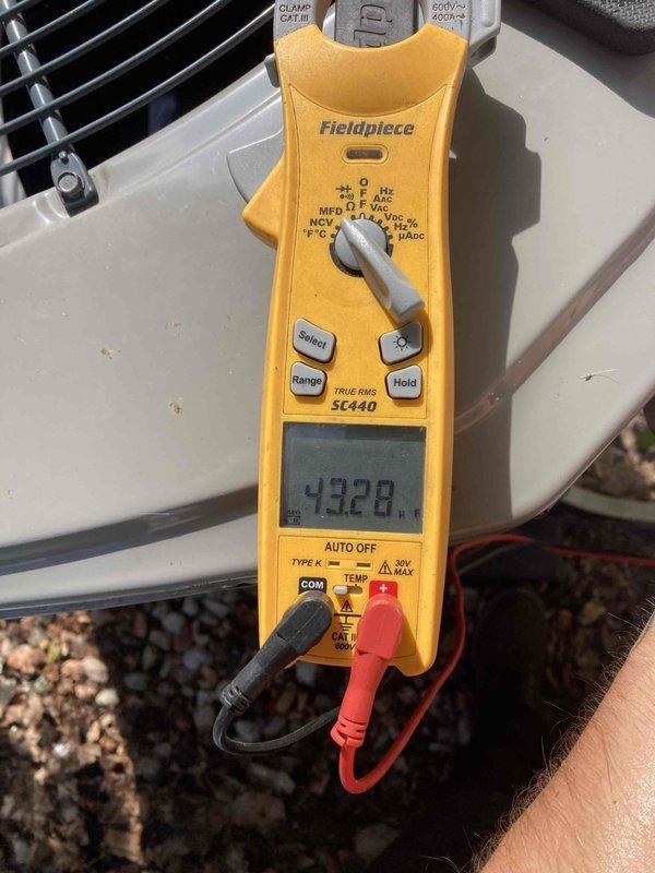Completed preventive maintenance tune-up on HVAC system, measuring system amperage at 4.3 amps and verifying proper electrical operation. Provided thermostat adjustment assistance per customer request and delivered replacement furnace filters. Inspected blower assembly and confirmed clean operation of fan cage and housing with normal dust accumulation for routine maintenance interval.