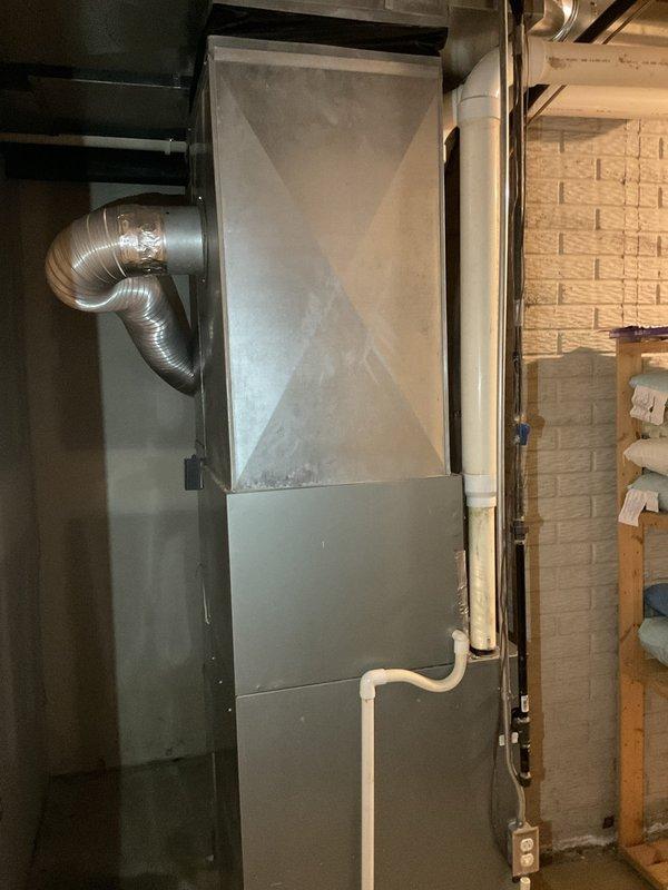 Conducted estimate for air conditioning system replacement. Evaluated existing R-22 system and determined unit was low on refrigerant with additional mechanical issues requiring extensive repairs. Assessed that repair costs would exceed value of aging equipment, making replacement the more economical solution. Documented current furnace and air handler configuration in basement mechanical room. Provided recommendations for new AC system installation to replace obsolete R-22 unit.