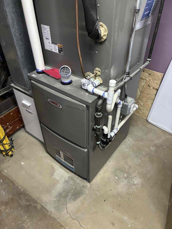 Completed permit-related callback on Lennox furnace installation. Sealed leaking seams on furnace cabinet and ductwork connections using approved mastic and foil tape to ensure airtight system operation. Installed safe-t-switch on secondary drain line of evaporator coil to prevent potential water damage from condensate overflow.