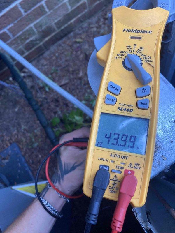 Completed scheduled Club AC x24-6 preventive maintenance visit on air conditioning system. Performed comprehensive system diagnostics using digital multimeter to measure electrical parameters. Recorded compressor amperage draw at 43.99 amps and verified control board voltage reading at 20.7 volts, both within manufacturer specifications. Inspected internal electrical components including circuit board, wiring connections, and control panel for proper operation and signs of wear. All electrical connections found secure with no loose terminals or damaged wiring observed. System operating normally with no deficiencies noted at time of inspection.