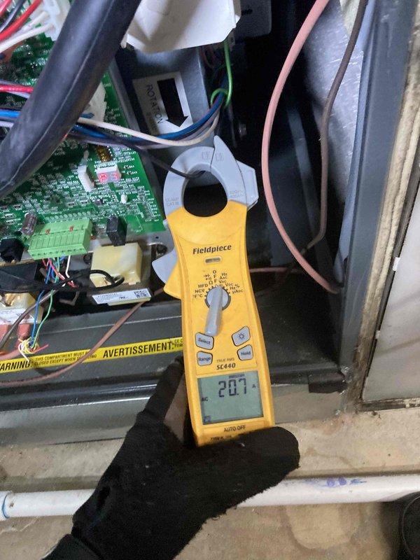 Completed scheduled Club AC x24-6 preventive maintenance visit on air conditioning system. Performed comprehensive system diagnostics using digital multimeter to measure electrical parameters. Recorded compressor amperage draw at 43.99 amps and verified control board voltage reading at 20.7 volts, both within manufacturer specifications. Inspected internal electrical components including circuit board, wiring connections, and control panel for proper operation and signs of wear. All electrical connections found secure with no loose terminals or damaged wiring observed. System operating normally with no deficiencies noted at time of inspection.
