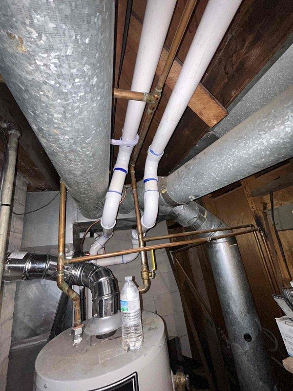 Completed full HVAC system installation including a 70,000 BTU furnace, 2-ton air conditioning unit with rear discharge configuration, and whole-home humidifier. Installed all necessary PVC venting, electrical connections, and ductwork modifications to accommodate new equipment. Reconnected existing systems, completed mechanical and electrical permits, and filled out gas utility rebate documentation for customer submission.