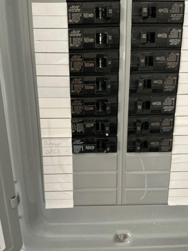 Installed outdoor GFCI receptacle in weatherproof Intermatic enclosure on exterior siding. Wired dual outlet with integrated toggle switches and indicator light, then connected circuit to dedicated breaker in main electrical panel labeled "Outdoor GFCI." Verified proper ground fault protection and tested functionality of all outlets and switches to ensure code-compliant operation.