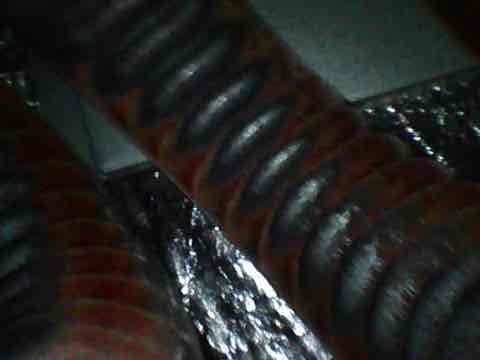 Responded to no cooling complaint on aging air conditioning system. Upon inspection, found evaporator coil heavily deteriorated with significant corrosion and oxidation throughout the coil fins and tubing. The coil showed advanced age-related degradation consistent with a unit over 10 years old, compromising heat transfer efficiency and refrigerant flow. Documented condition with photos showing the corroded coil assembly and surrounding ductwork. Advised customer of findings and provided recommendations for system replacement due to the extent of component failure and age of equipment.