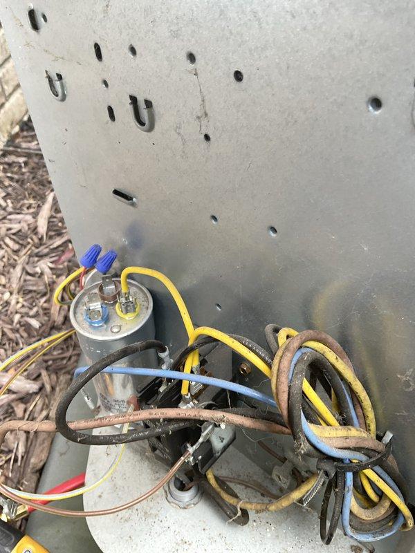 Responded to no-cool call with reported water leakage from furnace area. Upon arrival, inspected 8-year-old air conditioning system and discovered condensate drain line issue preventing proper drainage. Examined evaporator coil and found restricted airflow due to accumulated debris on aluminum fins. Cleared condensate drain line obstruction and verified proper drainage flow. Inspected outdoor condensing unit components including capacitor and wiring connections, which showed signs of age-related corrosion on mounting hardware but remained functional. Cleaned evaporator coil fins to restore airflow and tested system operation. Confirmed AC system cooling properly with no further water leakage. Advised monitoring condensate drainage and recommended routine maintenance to prevent future blockages.