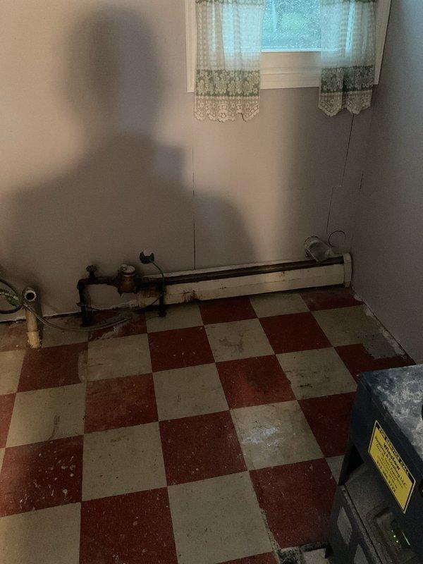 Conducted on-site evaluation for air conditioning system addition to property currently equipped with boiler heating only. Assessed existing mechanical room infrastructure, including oil-fired boiler system with baseboard radiator distribution. Documented current heating equipment configuration and available space for potential AC installation. Evaluated electrical service capacity, ductwork requirements, and optimal placement options for new cooling system components to integrate with existing boiler heat while maintaining efficient operation of both systems.