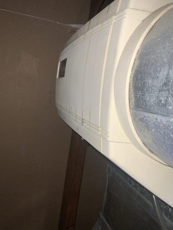 Completed city inspection for HVAC system per municipal requirements. Performed comprehensive tune-up on system over 10 tons, documenting equipment condition with photographs including water heater/storage tank and air handler ductwork showing significant dust accumulation on surfaces, which was noted for future maintenance consideration.