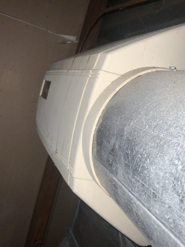 Completed city inspection for HVAC system per municipal requirements. Performed comprehensive tune-up on system over 10 tons, documenting equipment condition with photographs including water heater/storage tank and air handler ductwork showing significant dust accumulation on surfaces, which was noted for future maintenance consideration.