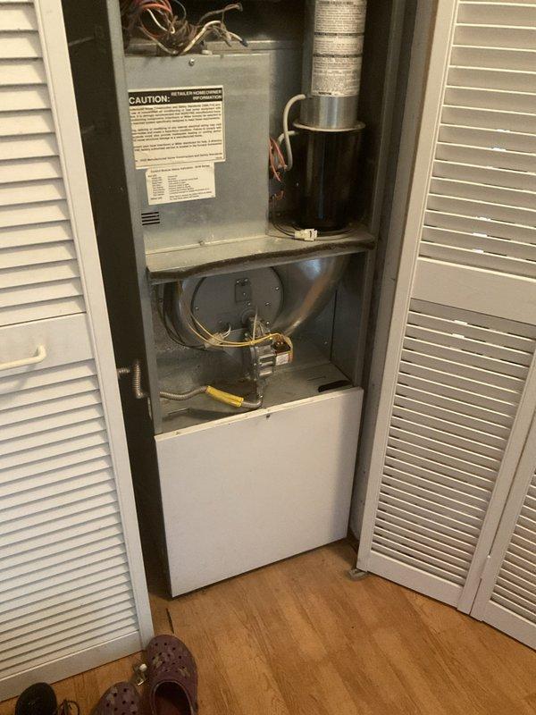 Conducted estimate for complete HVAC system replacement after diagnosing failed outdoor condensing unit with overheating compressor experiencing lock-up condition and determining existing R-22 refrigerant system requires replacement due to obsolete refrigerant phase-out. Evaluated indoor vertical furnace and air handler assembly housed in closet configuration and outdoor cylindrical condensing unit, both showing age and wear, and provided replacement recommendations for full system upgrade to meet current efficiency standards and refrigerant regulations.