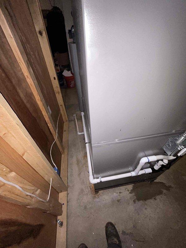 Completed full HVAC system installation in basement utility area including 90,000 BTU gas furnace and 3.5 ton air conditioning unit. Performed all mechanical and electrical connections per manufacturer specifications and local code requirements. Installed new PVC condensate drain piping with proper pitch and trap configuration. Routed flexible ductwork through ceiling joists and connected to new equipment. Ran electrical conduit and wiring to power units. Reconnected all system components and verified proper operation of heating and cooling functions. All equipment tested and operational upon completion.