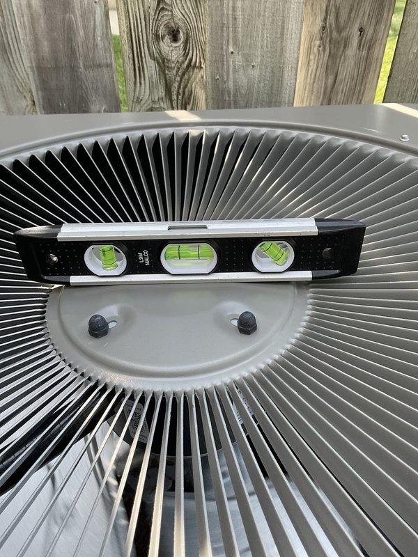 Completed scheduled preventive maintenance agreement visit for air conditioning system. Performed thorough inspection of condenser unit including examination of heat exchanger coil fins and verification of unit level positioning. Coil fins showed minor dust accumulation but remained in serviceable condition with proper airflow clearance. Confirmed outdoor unit maintains proper horizontal alignment and mounting stability. All system components operating within normal parameters at time of inspection.