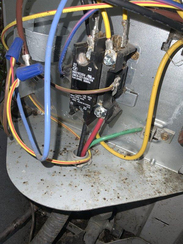 Responded to no cooling call on 9-year-old central air conditioning system. Upon arrival, confirmed outdoor unit was energized but not producing cold air. Inspected outdoor electrical disconnect box and found all connections secure with proper voltage present. Opened condensing unit control panel and identified failed contactor preventing compressor operation. Contactor showed signs of electrical wear with pitted contacts and degraded coil. Replaced defective contactor with OEM equivalent rated for system specifications. Verified all wire terminations were tight and properly connected. Restored power and tested system operation. Confirmed compressor engaged properly, unit cycled normally, and system returned to full cooling capacity. Left system operational with customer satisfied.