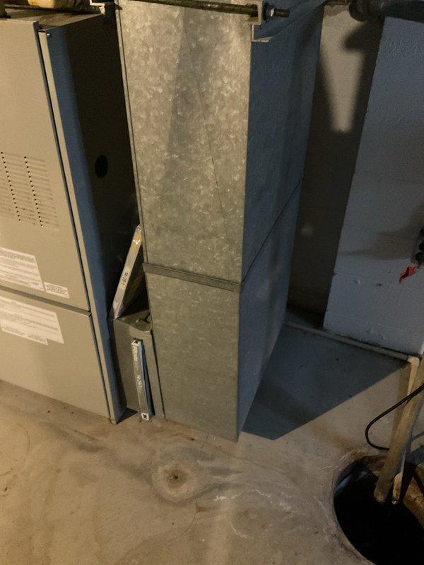 Provided comprehensive estimate for complete HVAC system replacement in basement installation. Existing 20-year-old natural gas furnace and associated equipment evaluated for replacement, including review of current ductwork configuration, electrical panel capacity, and existing plenum system. Documented current system layout with galvanized metal ductwork and blue distribution channels to ensure proper sizing and compatibility for new equipment installation.