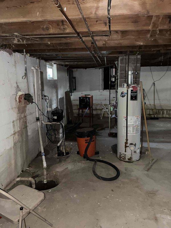 Provided estimate for replacement of non-functional boiler system with new Polar Package unit in basement location. Assessed existing mechanical room layout including water heater, sump pump system, and current heating equipment to determine optimal configuration for new HVAC installation. Documented basement conditions and existing utility infrastructure to prepare comprehensive equipment replacement proposal.