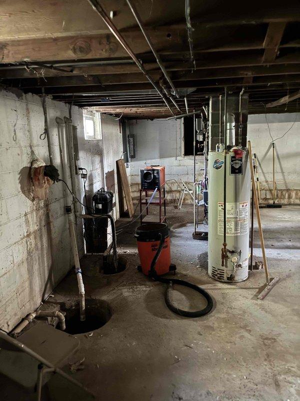 Provided estimate for replacement of non-functional boiler system with new Polar Package unit in basement location. Assessed existing mechanical room layout including water heater, sump pump system, and current heating equipment to determine optimal configuration for new HVAC installation. Documented basement conditions and existing utility infrastructure to prepare comprehensive equipment replacement proposal.