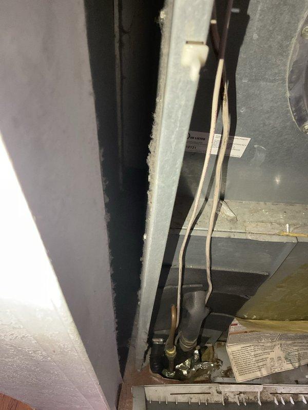 Completed estimate for air conditioning system replacement due to existing unit requiring multiple repairs and being low on R22 refrigerant. Assessed indoor air handler installation in wall cavity with existing ductwork and electrical connections, and evaluated outdoor electrical service configuration at meter location. Documented current system conditions and provided replacement options for new equipment installation.