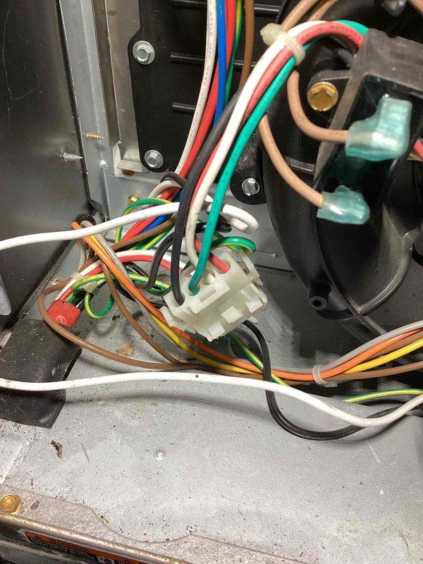 Completed routine HVAC maintenance agreement visit for air conditioning and system inspection at second service location. Performed thorough inspection of electrical control compartment, documenting low-voltage control wiring connections including terminal blocks, wire bundles, and relay assembly components to verify proper system configuration and safe operation. All wiring connections, color-coded conductors, and control components were inspected and found to be functioning within normal parameters.