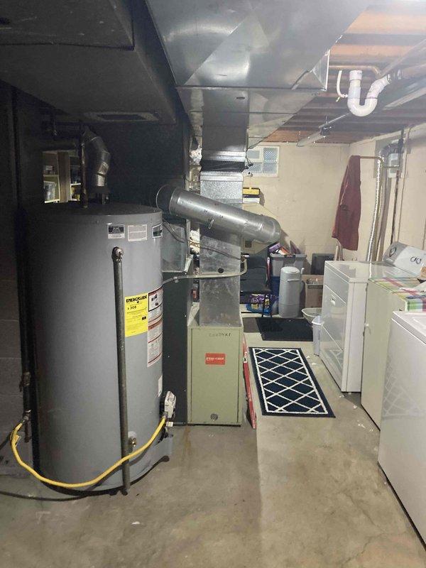 # Emergency No-Heat Call - 10-Year-Old Goodman Furnace

Responded to emergency service call for non-operational furnace in residential basement. Upon arrival, inspected 10-year-old Goodman gas furnace unit and associated HVAC system components. Performed diagnostic troubleshooting to identify cause of heating failure. Checked thermostat operation, verified gas supply to unit via flexible gas line connection, and inspected electrical connections. Examined furnace control board, ignition system, and flame sensor for proper functionality. Assessed air filter condition and verified adequate airflow through ductwork system. Tested safety switches including limit switches and pressure switches. Inspected condensate drain lines and PVC venting system for proper operation and blockages. Completed necessary repairs to restore heating operation. Cycled unit through multiple heating cycles to confirm proper ignition sequence, burner operation, and heat delivery through supply ductwork. Verified a