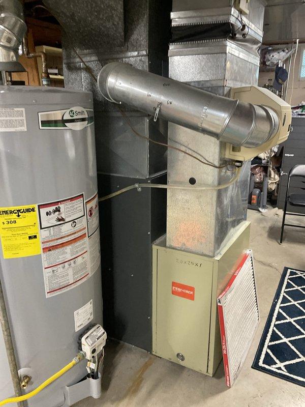 Conducted comprehensive assessment of aging HVAC system with failed control board and blower motor on furnace unit, and evaluated 2003-model air conditioning condenser operating on R22 refrigerant. Documented equipment conditions, recorded model and serial numbers from both indoor and outdoor units, and provided replacement estimate for complete system upgrade due to obsolete refrigerant and multiple component failures making repairs uneconomical.