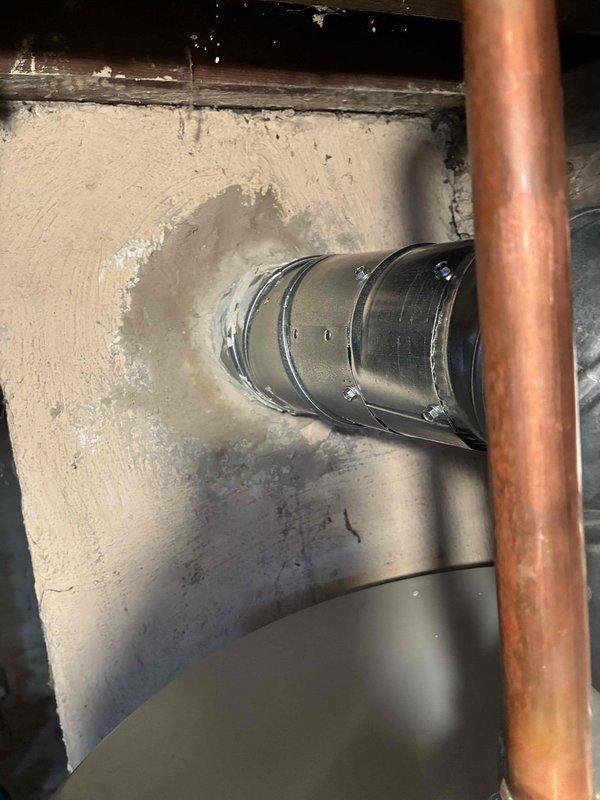 Installed a new 40-gallon liquid propane water heater in the crawl space utility area. Connected copper supply lines and integrated the unit with existing HVAC ductwork, ensuring all plumbing connections were properly secured and tested for leaks. Installation completed with all components functioning to manufacturer specifications.