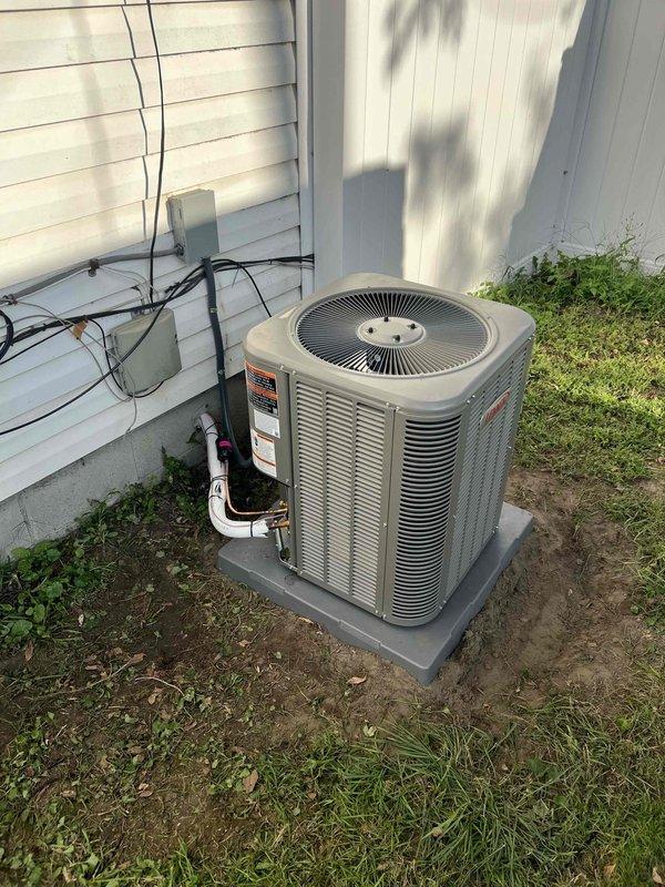 Completed full HVAC system installation including a 70,000 BTU furnace and 2-ton air conditioning unit. The outdoor condenser was positioned on a concrete pad in the rear yard with proper electrical conduit and refrigerant line connections run from the exterior wall. The furnace was installed in the attic space with complete PVC condensate drain piping system and flexible ductwork connections. All mechanical and electrical connections were completed, tested, and reconnected to ensure proper system operation.