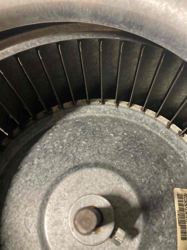 Completed routine HVAC maintenance agreement visit for air handler and system inspection. Documented significant dust and debris accumulation on blower wheel assembly and interior housing, indicating extended operation period since last cleaning. Replaced faulty flame sensor component during service call to ensure proper system operation and safety.