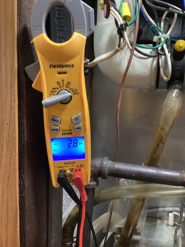 Performed preventive maintenance inspection on heating system under club membership agreement. Conducted comprehensive safety testing including carbon monoxide level verification, which registered 0.00 PPM indicating proper combustion and venting operation. Measured and documented electrical performance using digital multimeter, recording 2.0 DC voltage at capacitor terminals to verify proper component operation. All system components inspected and found operating within manufacturer specifications with no immediate service needs identified.