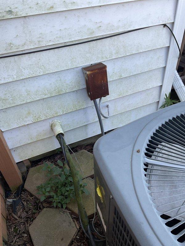 Conducted on-site evaluation of residential central air conditioning system experiencing low airflow throughout the entire home for approximately two years. Assessed existing outdoor condensing unit installed in 2008, approximately 18 years old, and documented current equipment condition with photographs. Provided comprehensive estimate for complete air conditioner replacement system.