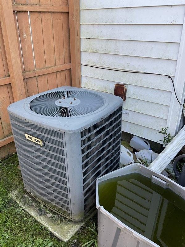 Conducted on-site evaluation of residential central air conditioning system experiencing low airflow throughout the entire home for approximately two years. Assessed existing outdoor condensing unit installed in 2008, approximately 18 years old, and documented current equipment condition with photographs. Provided comprehensive estimate for complete air conditioner replacement system.